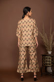 Nude brown soft muslin with bold flower printed top and bottom with belt