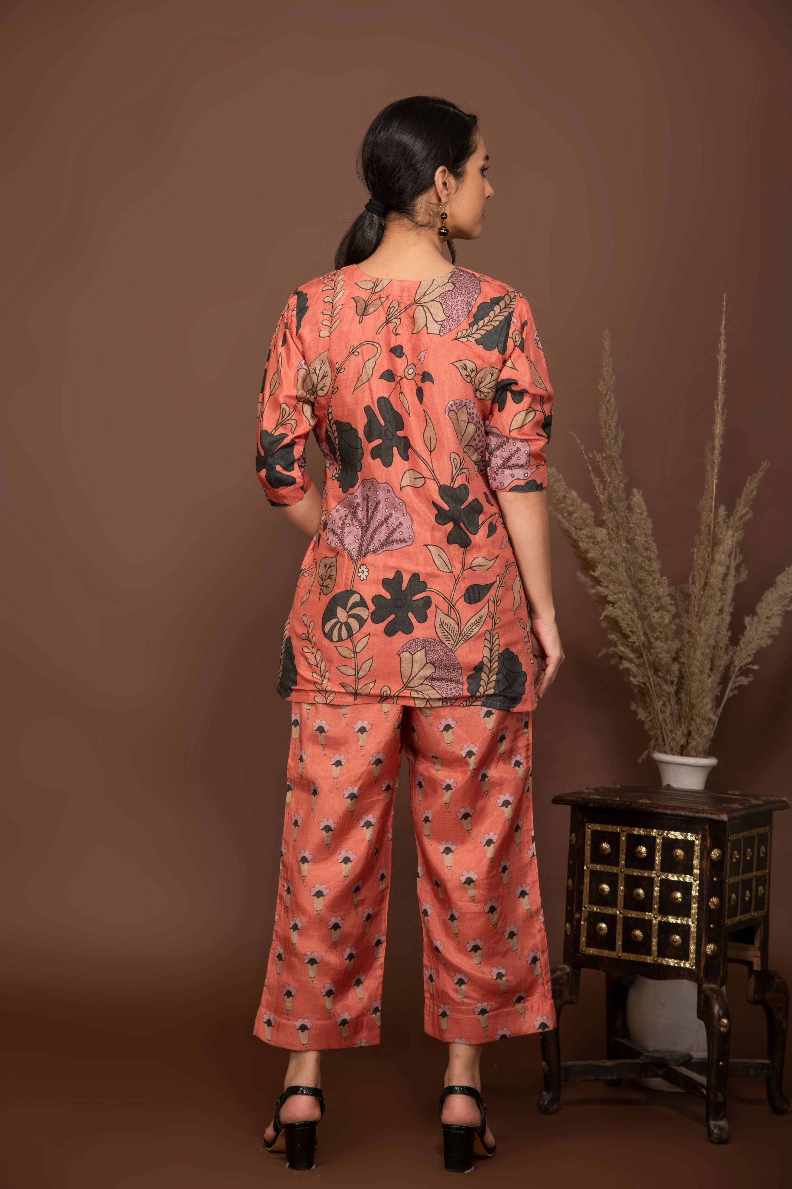 Peach soft muslin with bold flower printed top with butti printed bottom