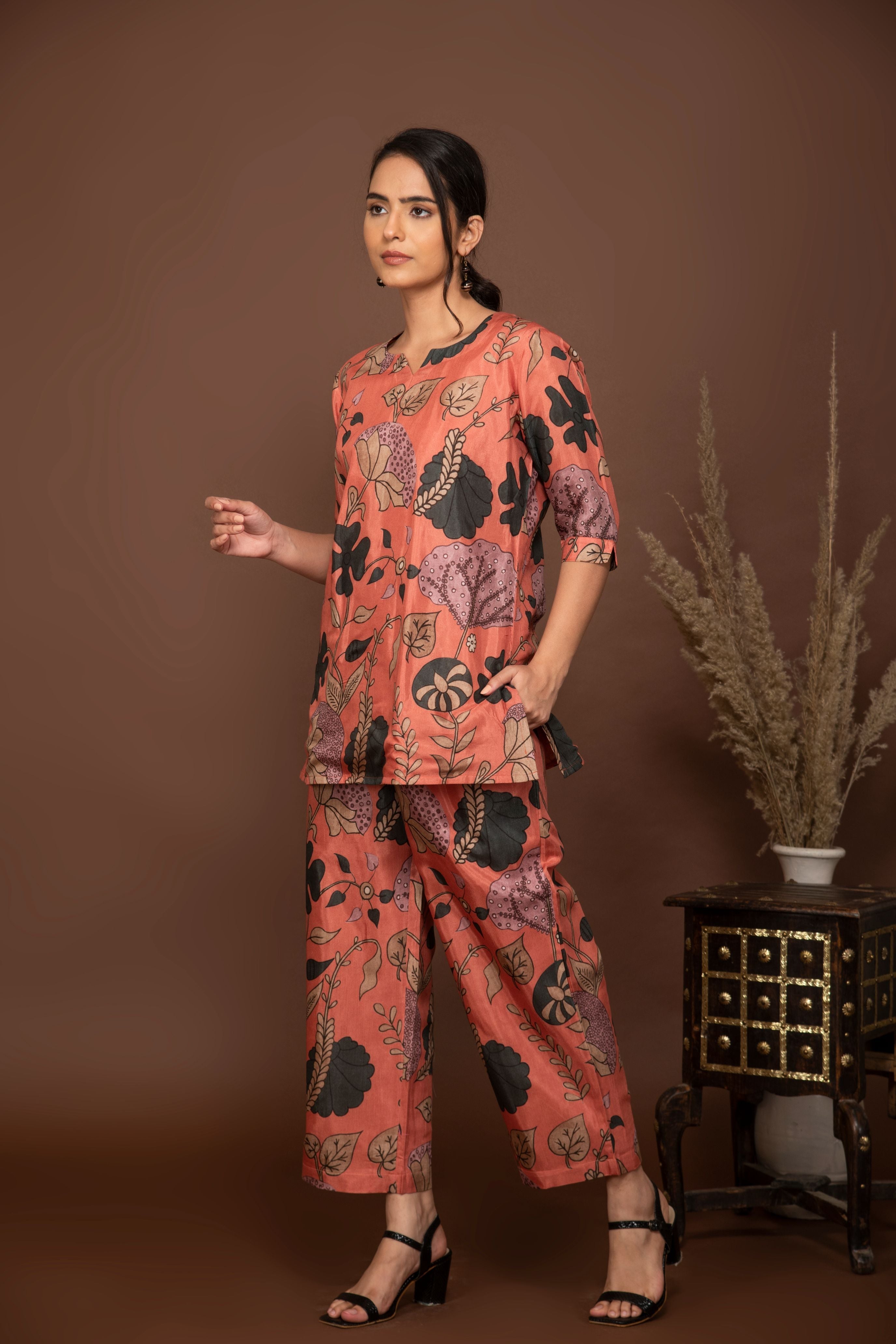 Peach soft muslin with bold flower printed top with butti printed bottom