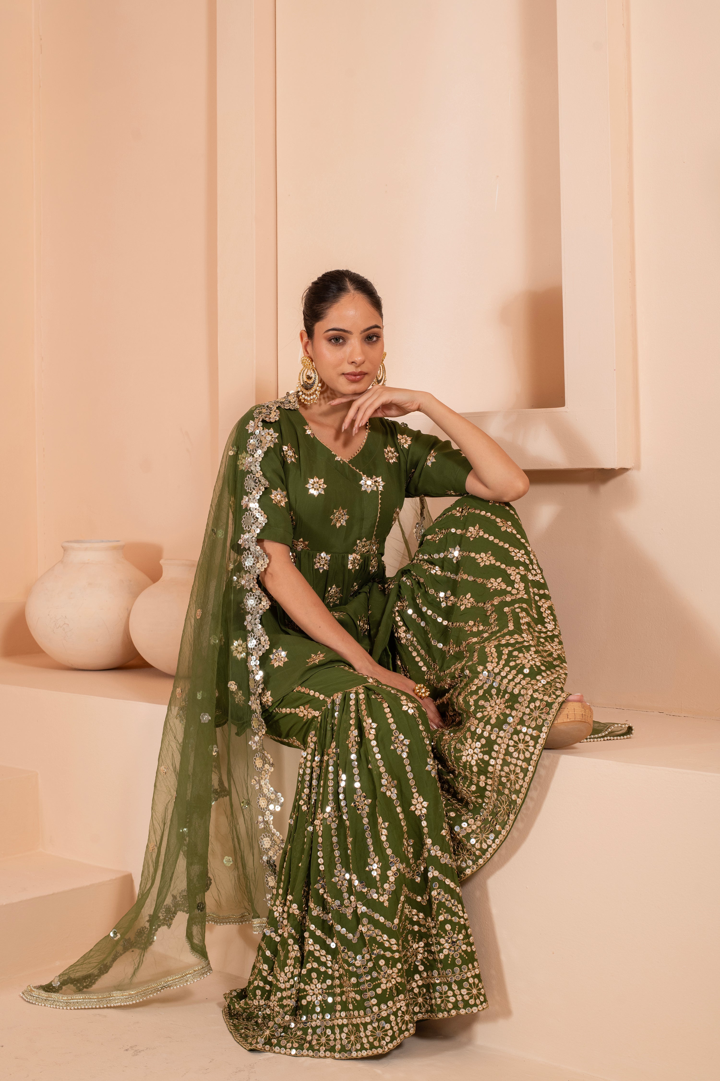 versatile embroidered peplum top dupatta set with embroidered sharara.