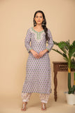 Light purple printed kurta with white printed bottom 3 piece suit set with printed buttis allover dupatta.