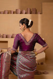 Silk blouse with intricate embroidery on the neck and sleeves.