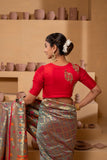 Red silk blouse with intricate embroidery for multiple pairings.