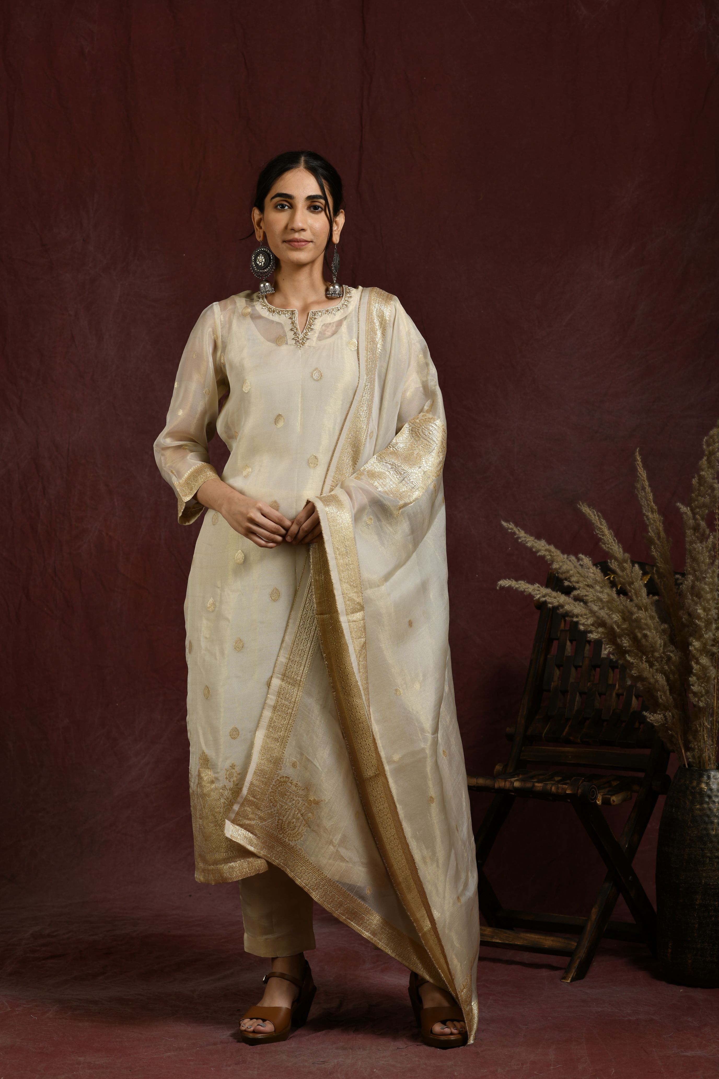 White and golden kurta and pant set with dupatta