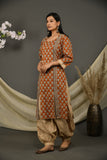 Rusted brown cotton jaipuri printed kurta with beige printed pants and dupatta.