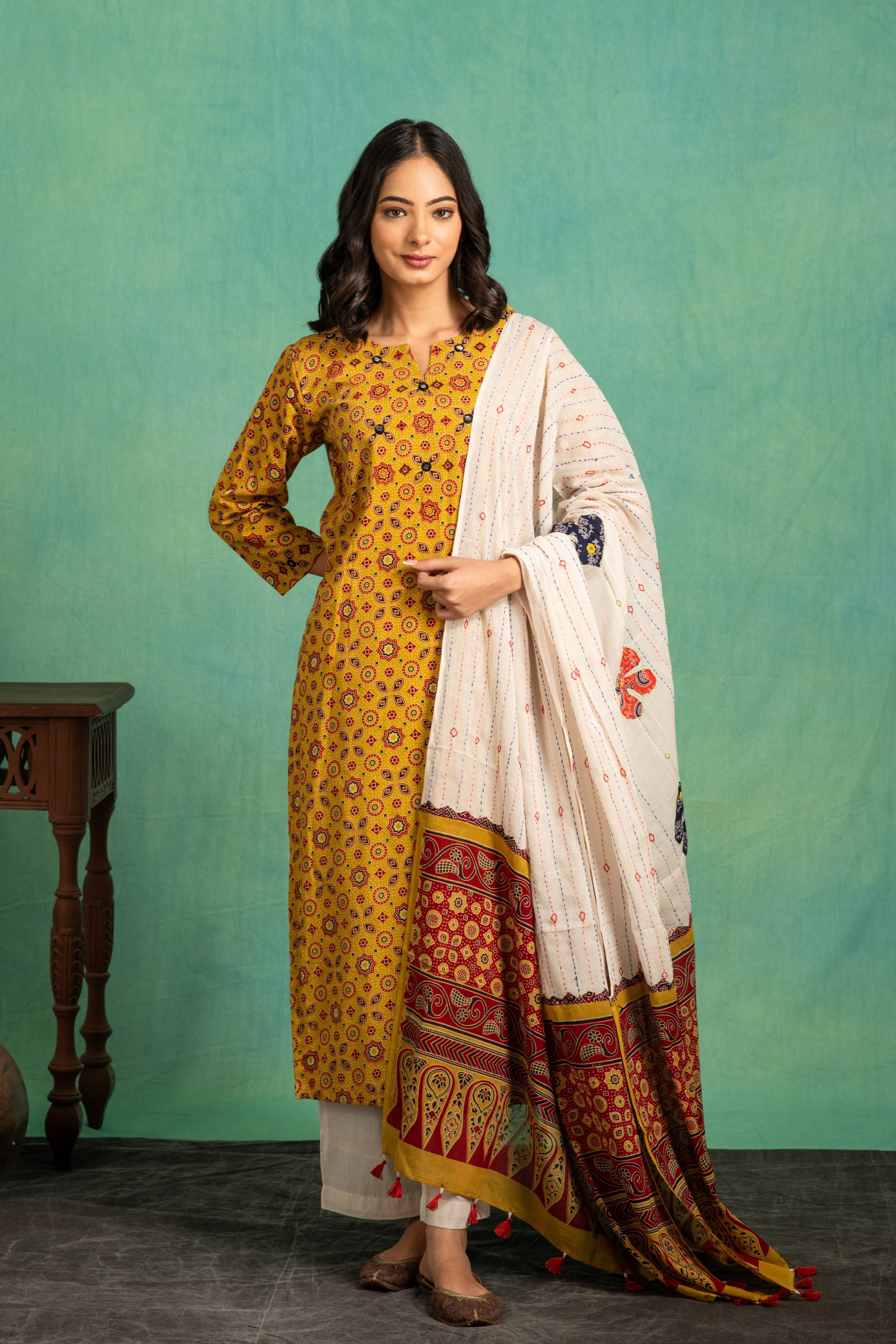 Ajrakh handblock pure cotton kurta and dupatta set with embroidered  necklineand a white cotton bottom.