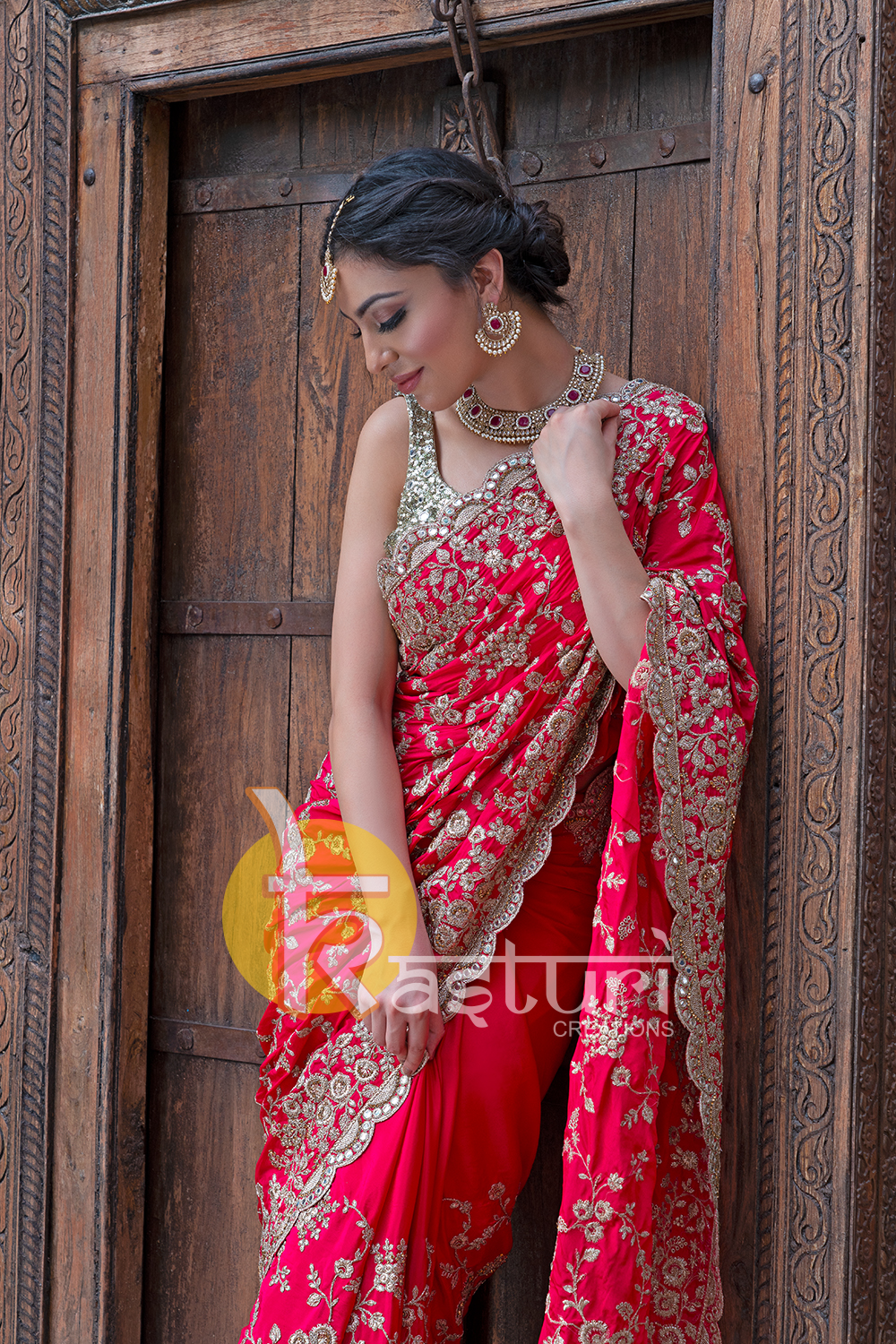 Red heavy embroidered crepe party wear saree