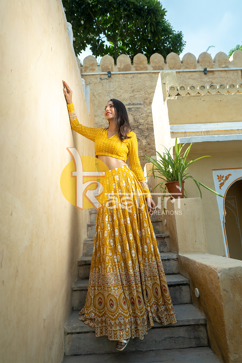 Mustard yellow mirror work embroidered georgette top with lehenga skirt