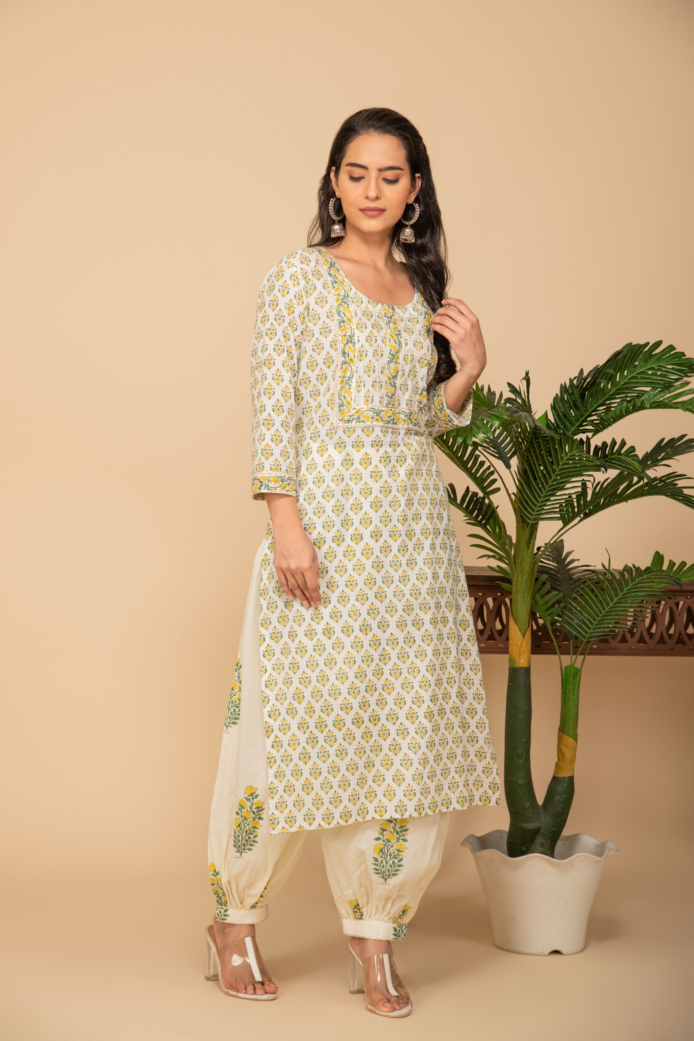 White buttis printed kurta with white/mustard printed bottom 3 piece suit set with contrasting mustard printed scallops all over dupatta.