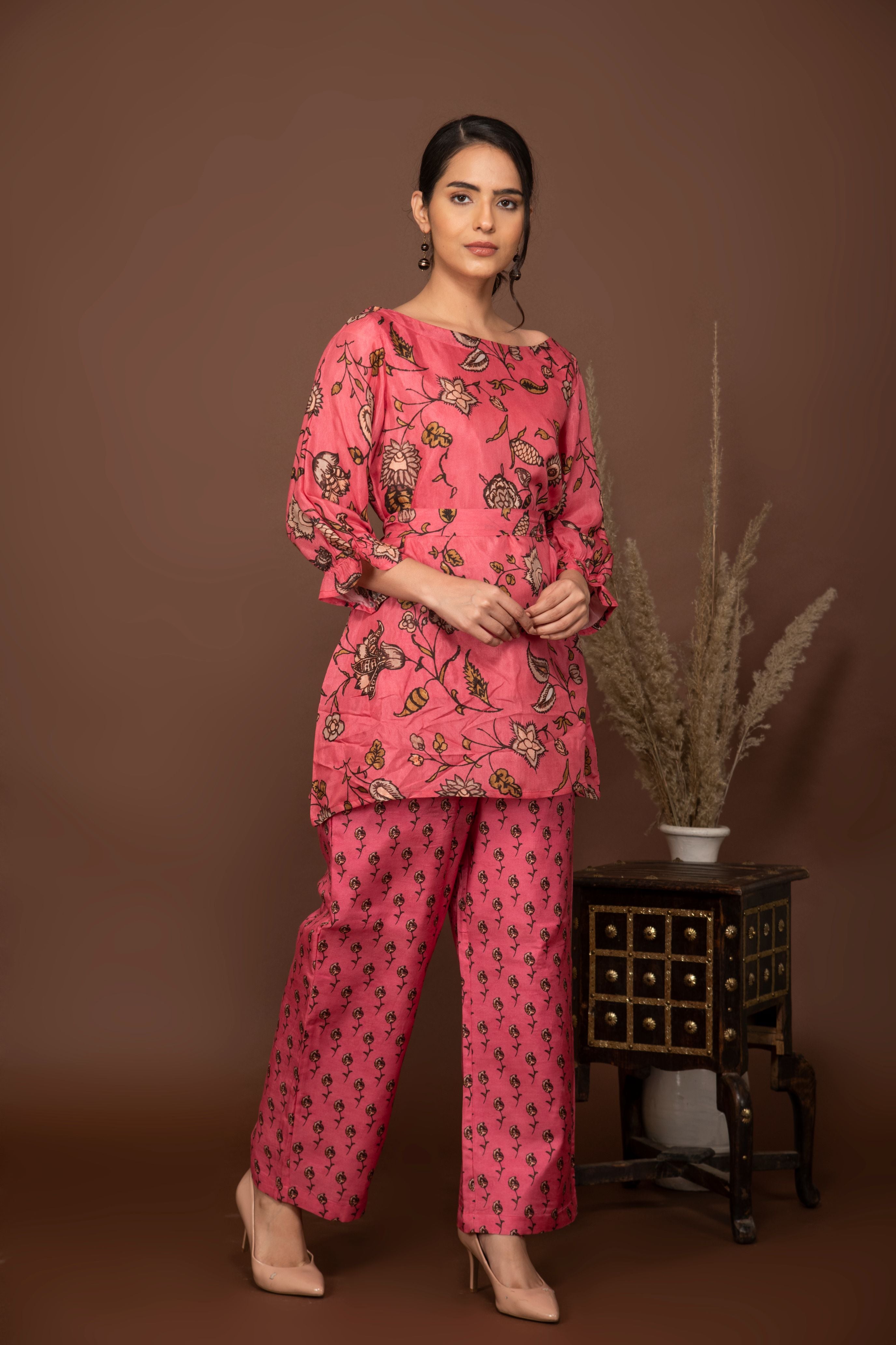 Pink soft muslin with big floral printed top with butti printed bottom all over.