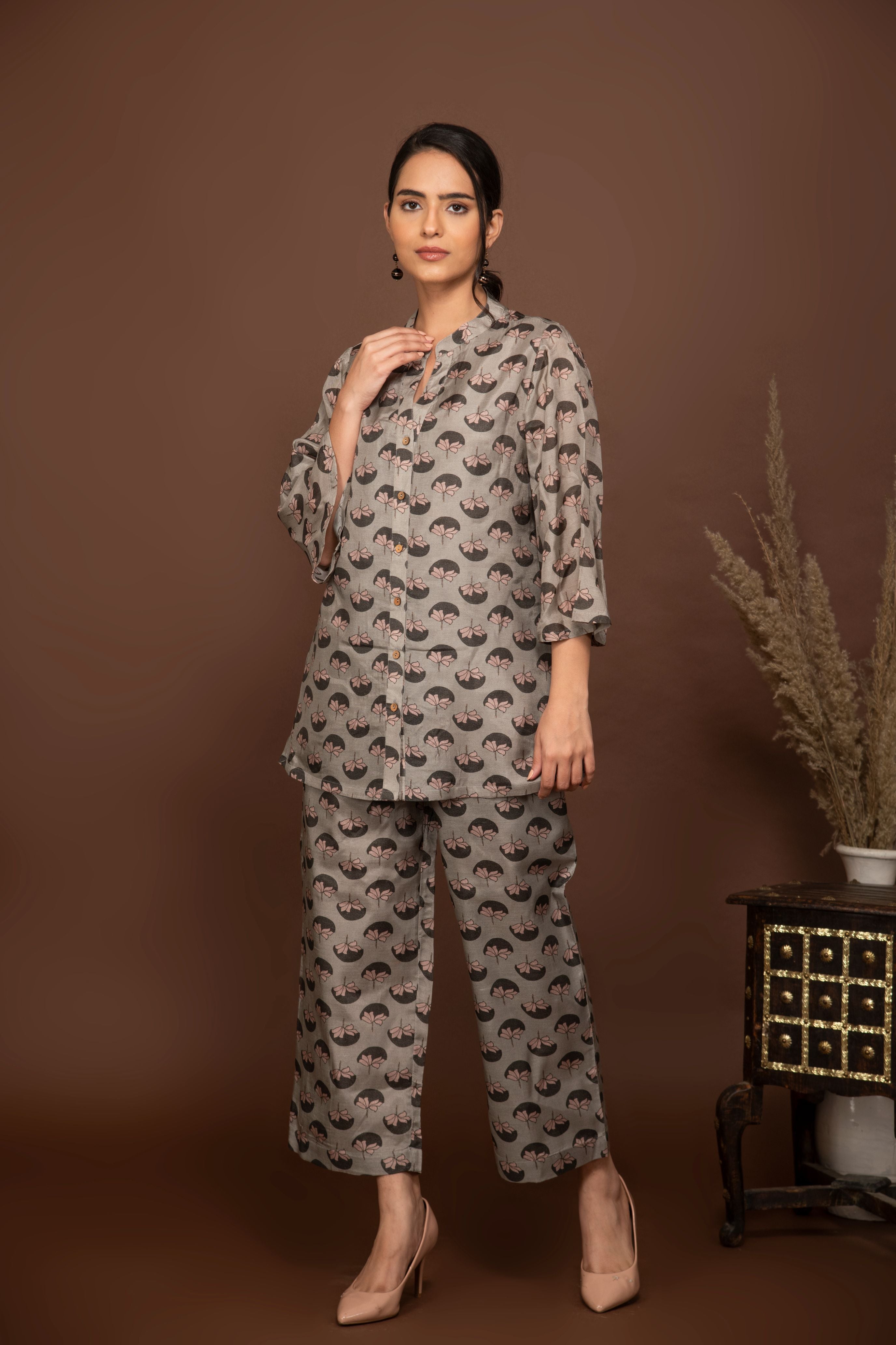 Grey soft muslin with  flower buttis printed top and bottom all over.