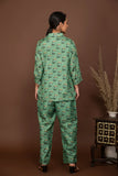 Teal green soft muslin with buttis printed top and bottom all over.