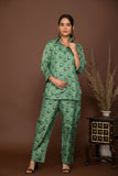Teal green soft muslin with buttis printed top and bottom all over.