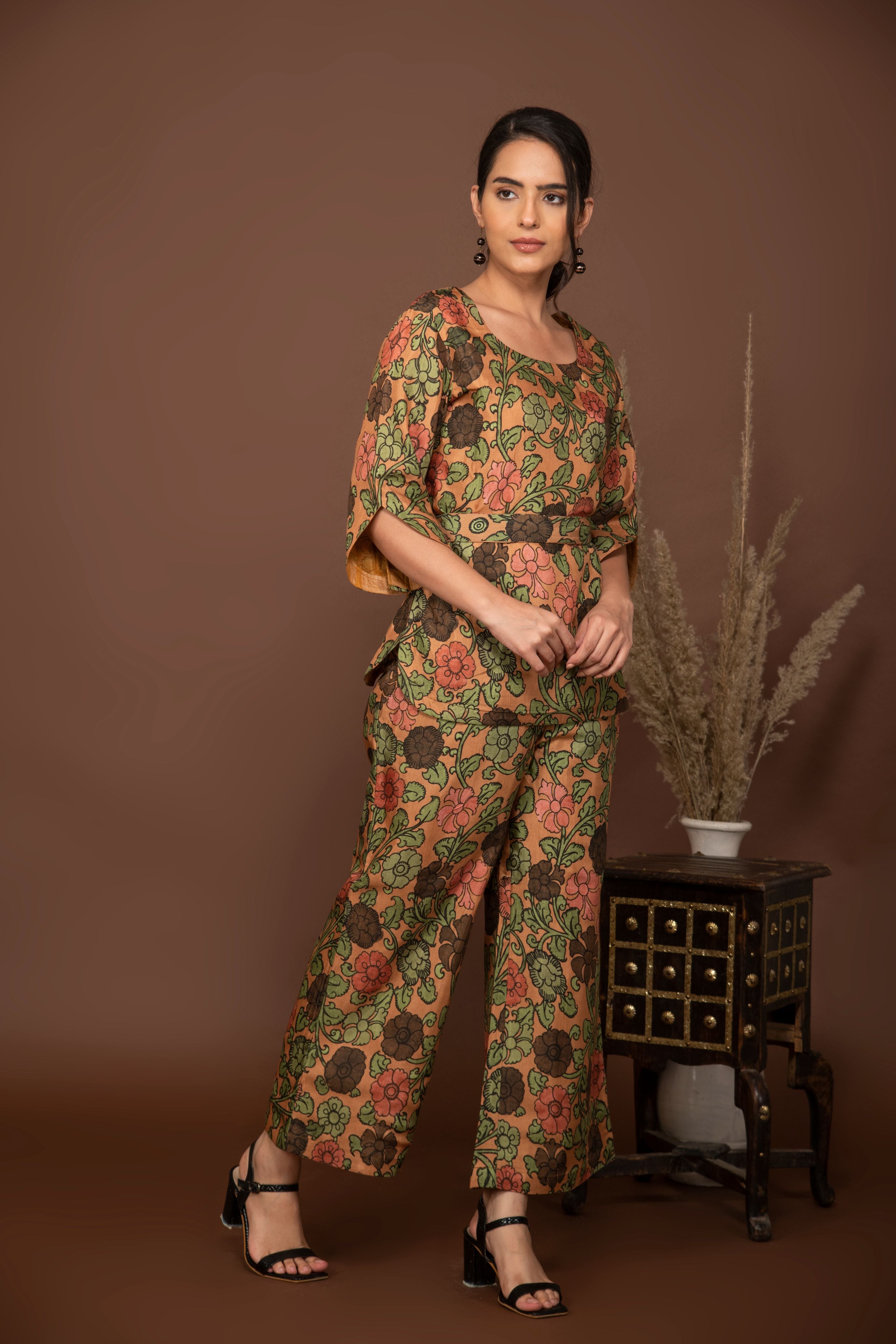 Nude brown soft muslin with bold flower printed top and bottom with belt.