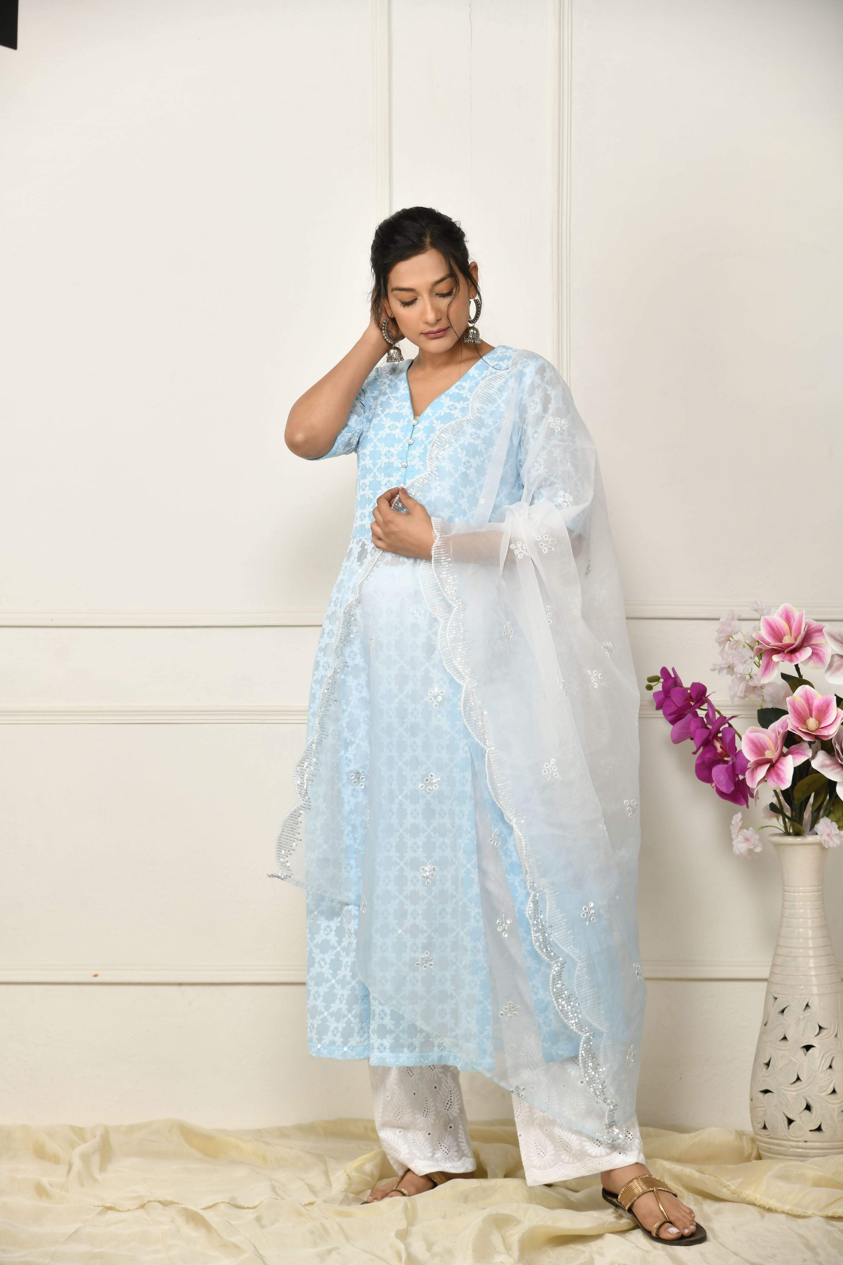 Blue georgette thread embroidered flared top with a front slit and a yoke lining .â 